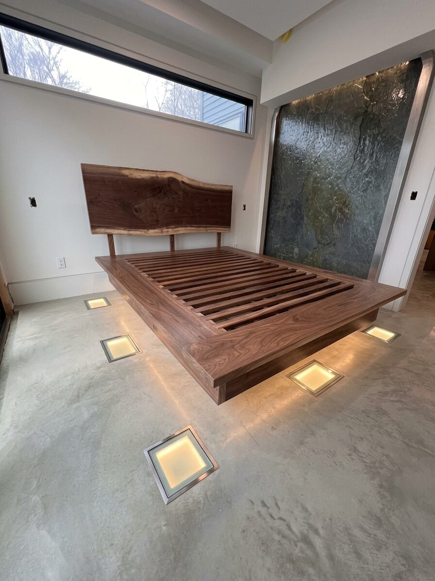 Walnut platform bed with live-edge headboard and recessed underlighting, Fairfax, Vermont