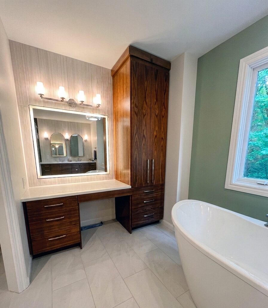 Walnut vanity desk with backlit mirror and full-height pantry cabinet