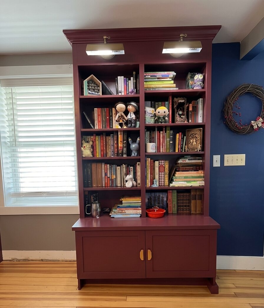 Detail of built-in bookcase with sconce lighting